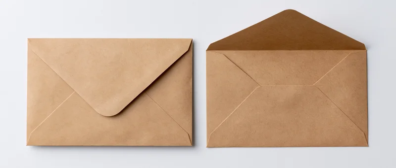 Two kraft paper envelopes side by side, one closed and one open, on a white background