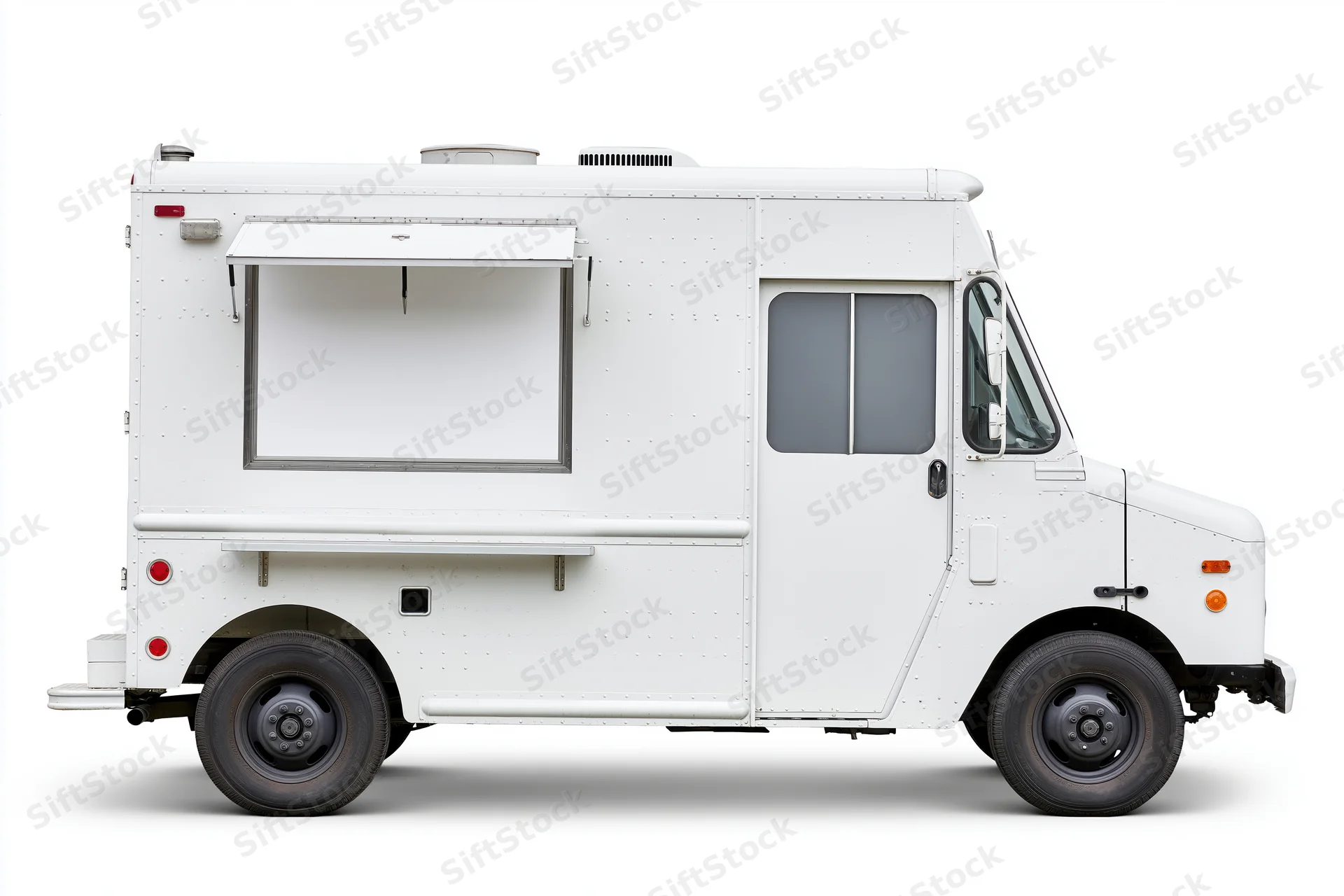 White food truck parked and viewed from the side with blank menu window