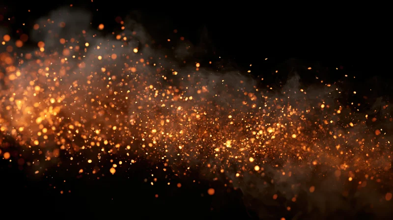 Glowing embers and smoke drifting across a dark background