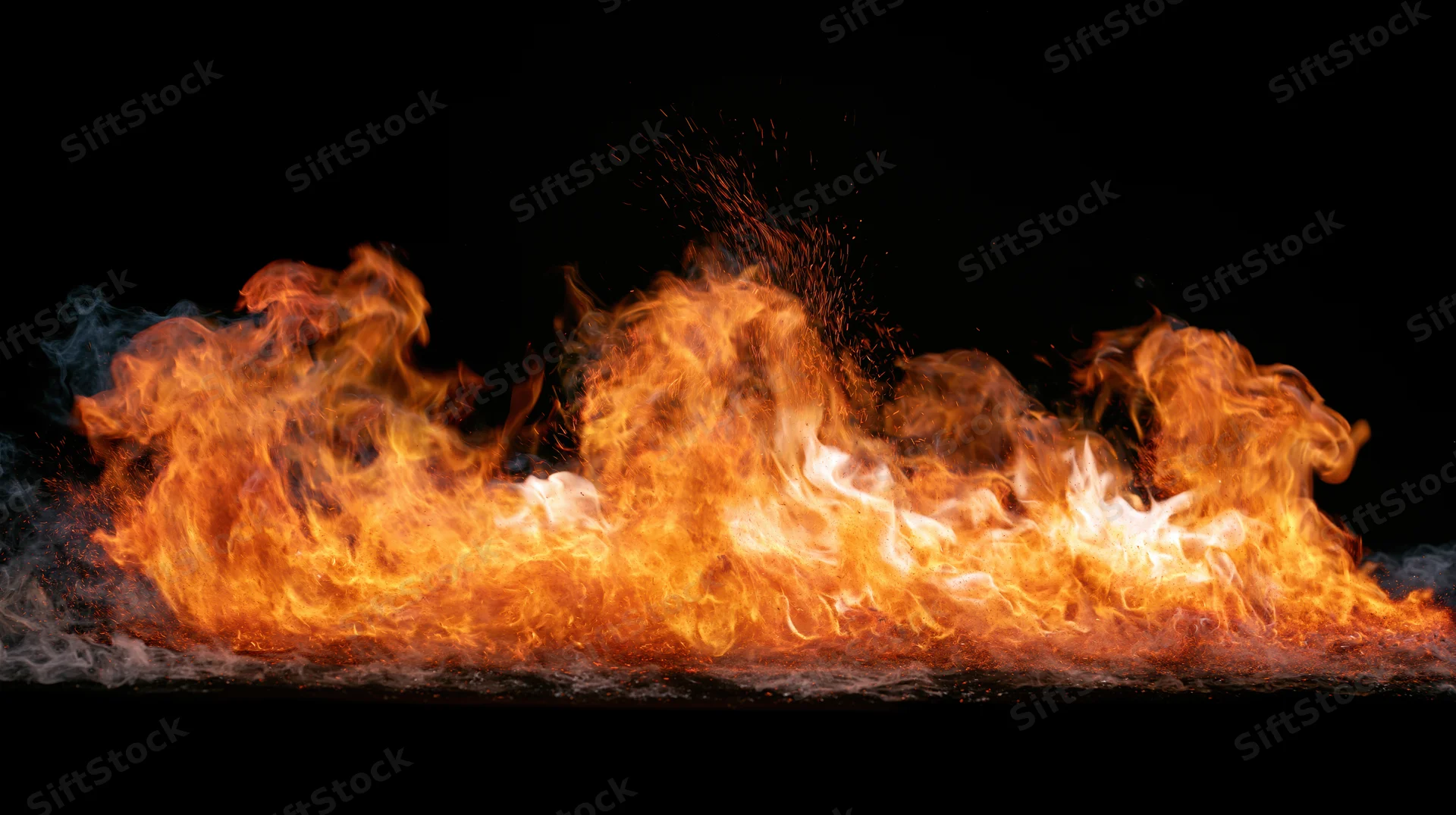 Horizontal band of fire burning intensely against a black background