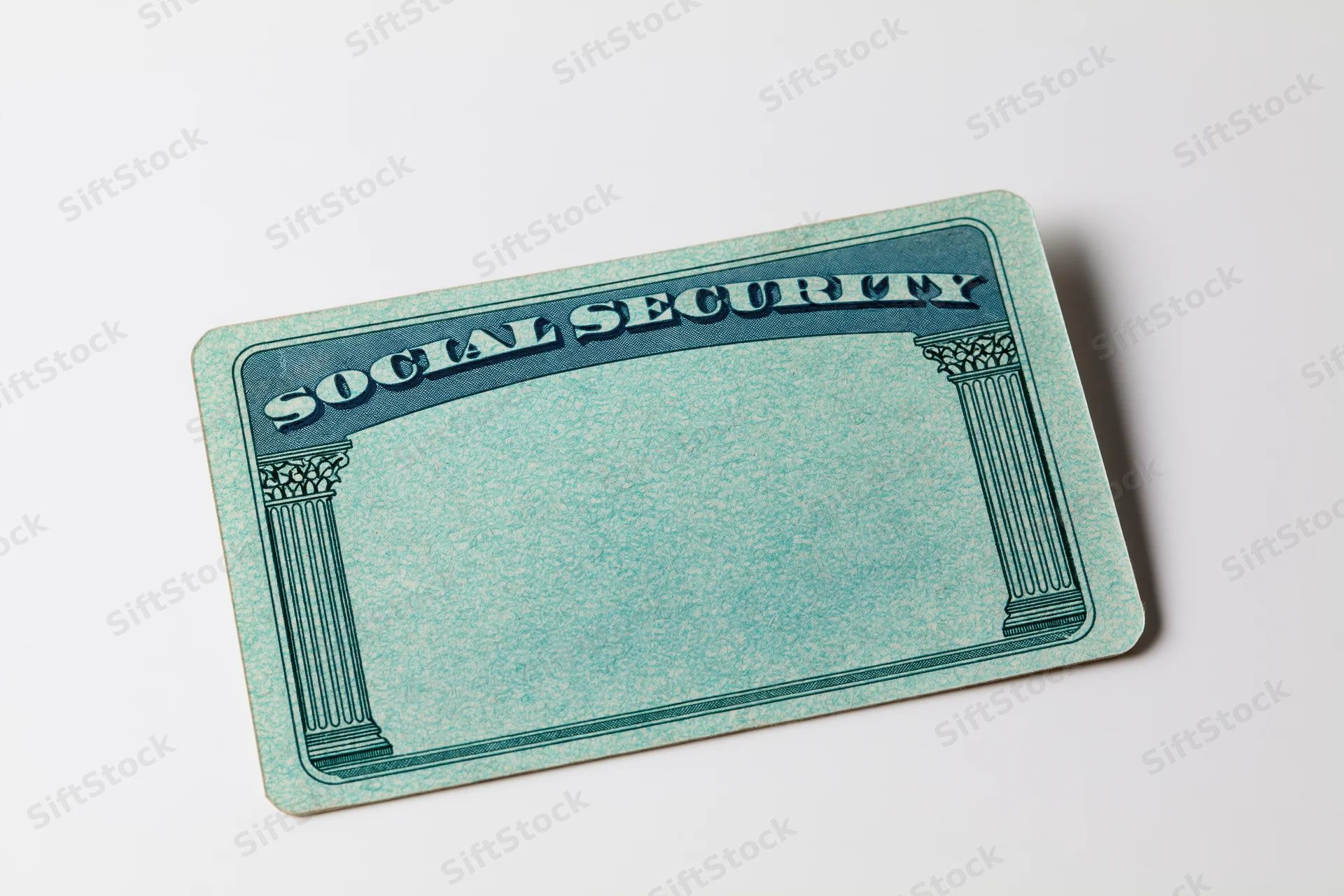 Blank us social security card lying flat on white background