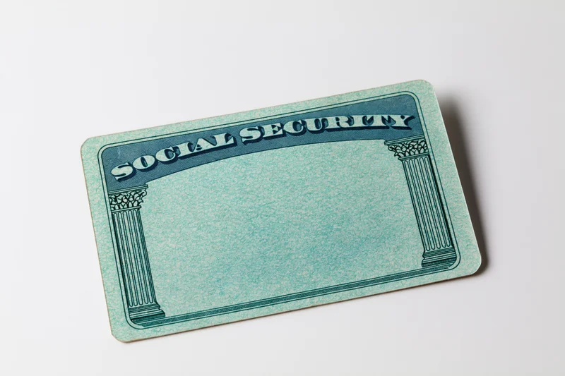 Blank us social security card lying flat on white background