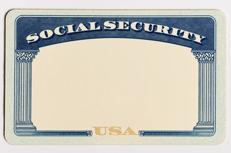 Blank united states social security card lying flat with blue border and columns