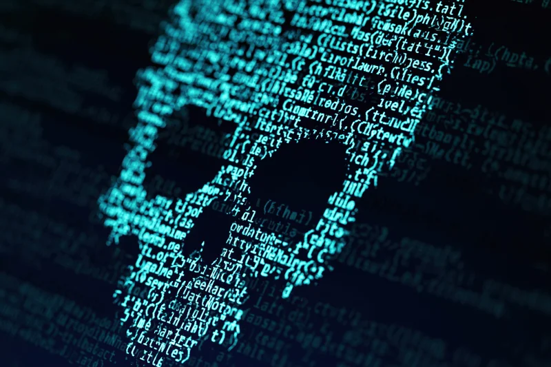 Glowing cyan code lines on a dark computer screen