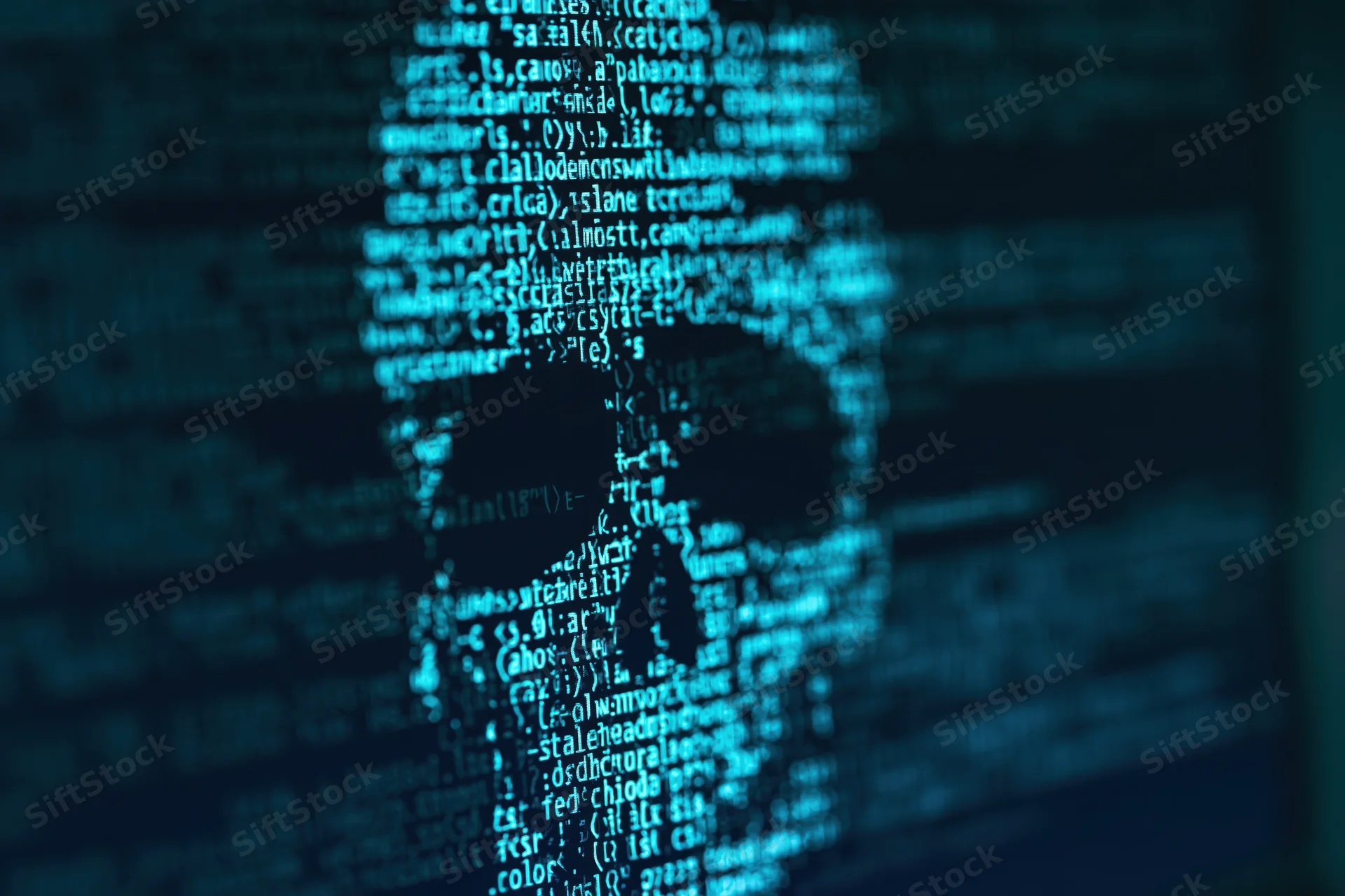 Glowing skull formed from lines of code on a dark computer screen