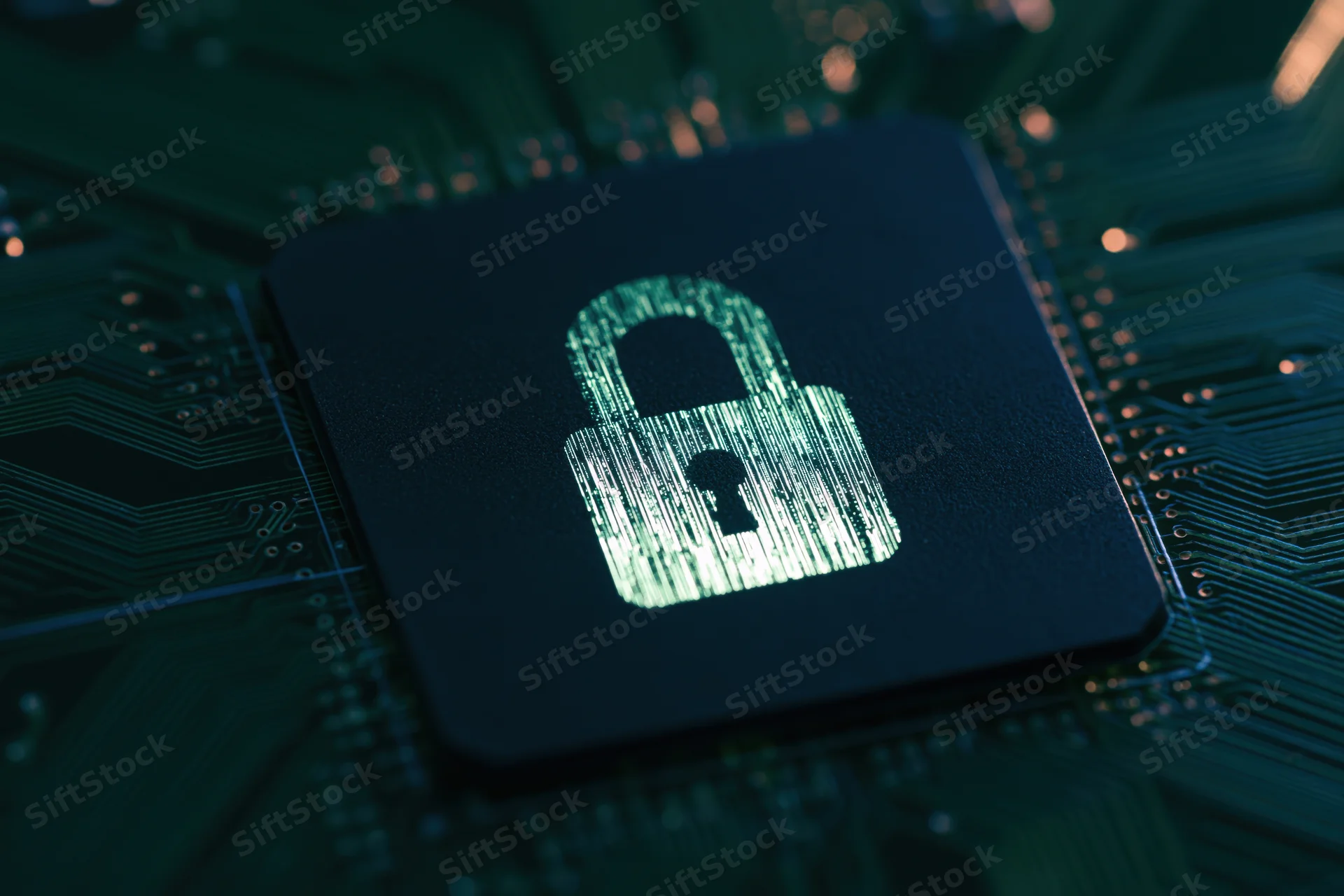 Glowing padlock symbol on a dark circuit board closeup