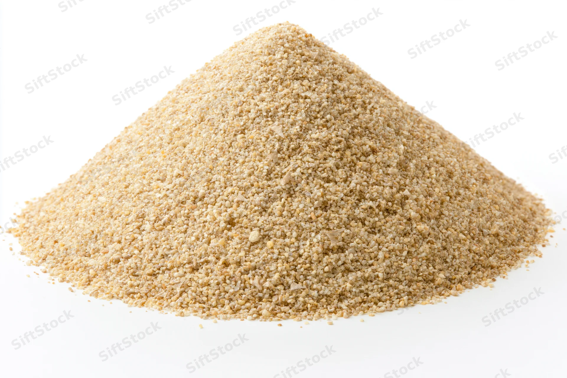 Conical pile of coarse dry sand on white background