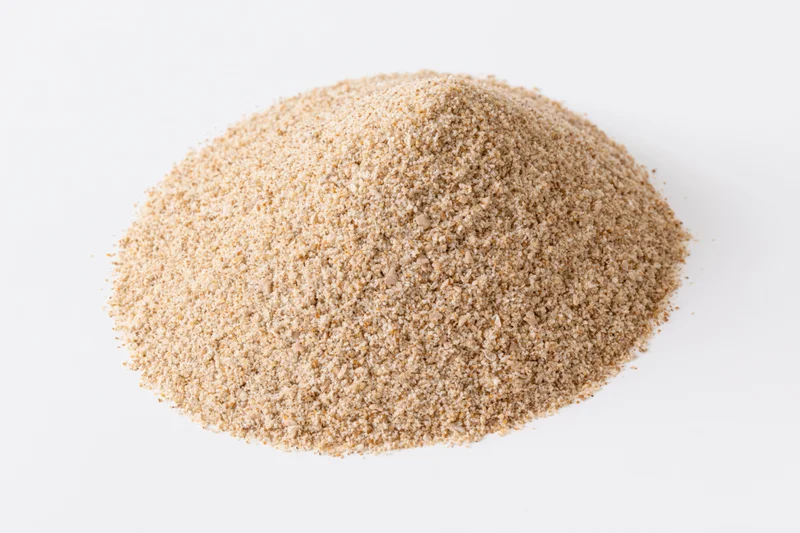 Mound of dry beach sand isolated on white background
