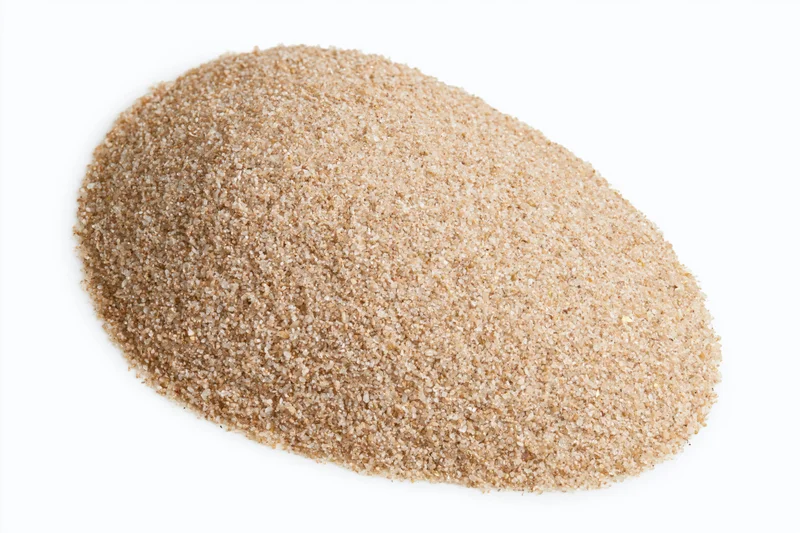A mound of dry beach sand isolated on a white background