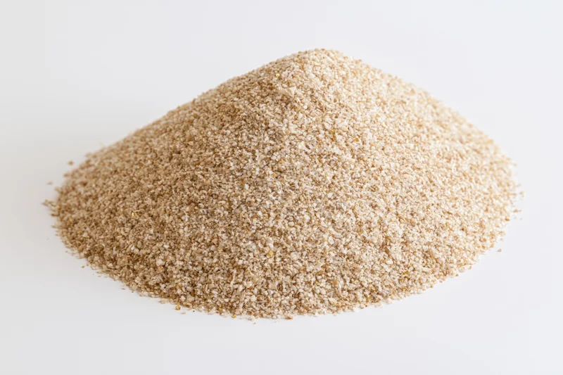 Mound of dry beach sand isolated on white background