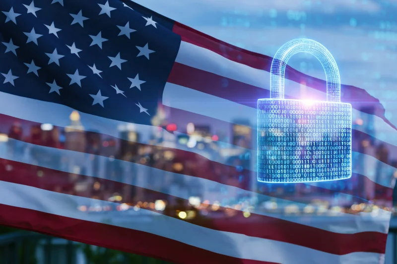 American flag waving over city skyline with digital lock and binary code overlay