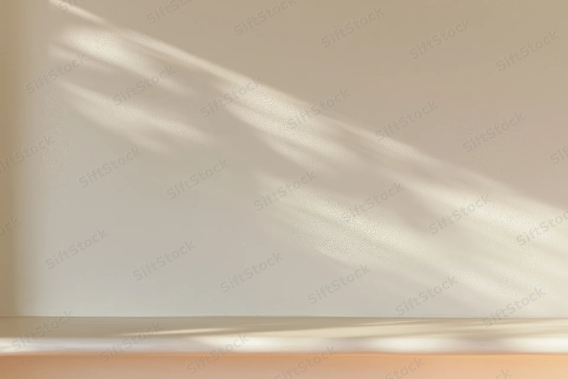 Cream-white plaster wall with soft sunlight casting diagonal shadows across smooth matte surface