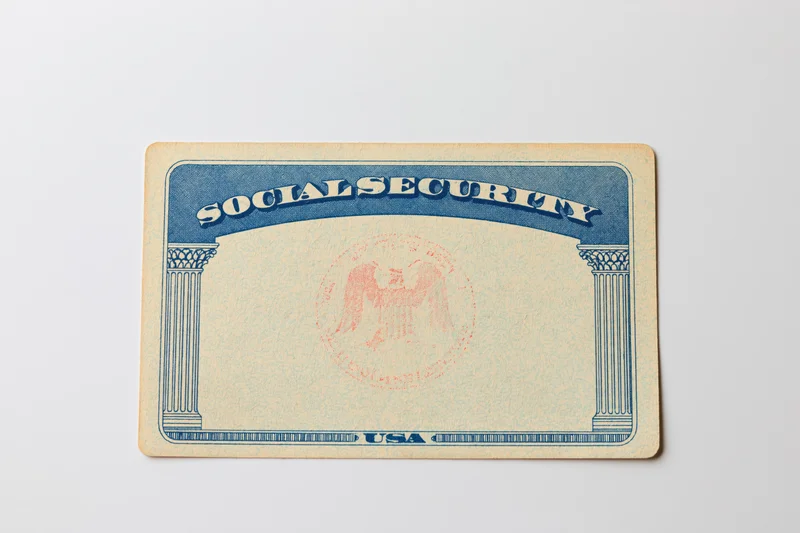 Blank us social security card lying flat on white surface