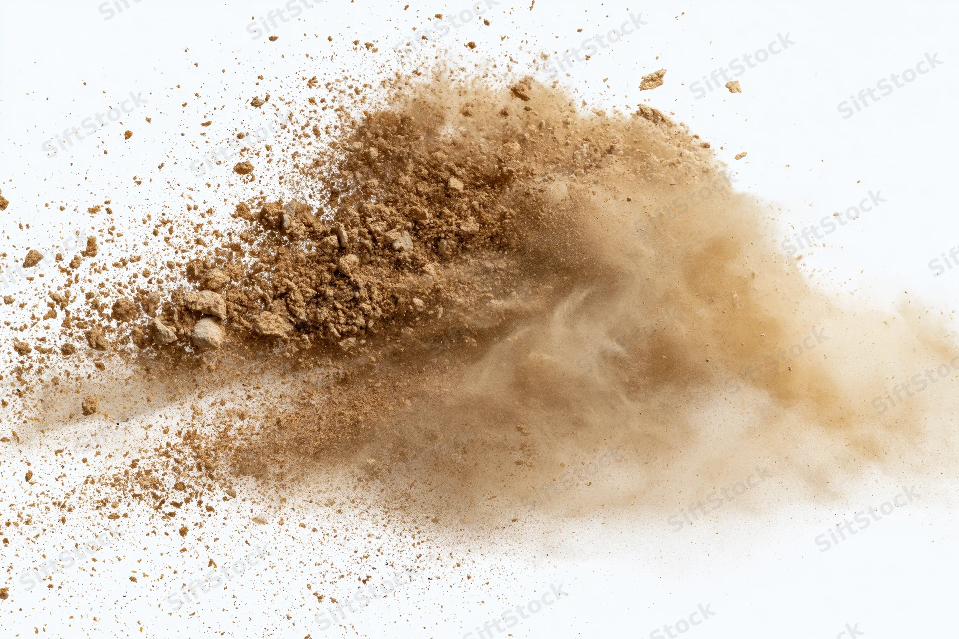 Brown sand and dirt powder exploding mid-air against white background
