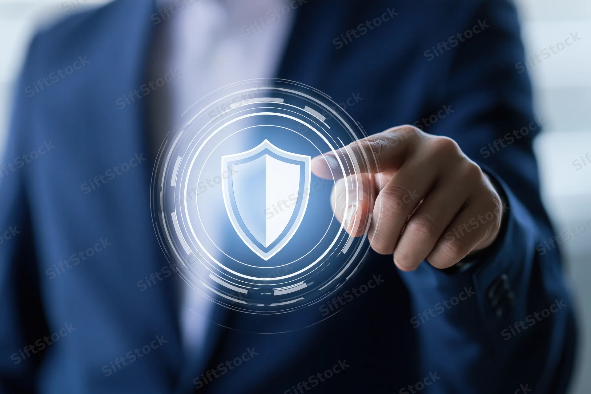 Businessman pressing index finger on digital shield interface in office setting