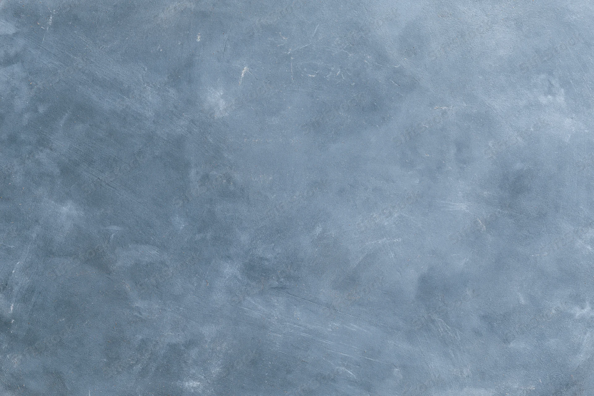 Weathered concrete surface with gray-blue texture and subtle cracks