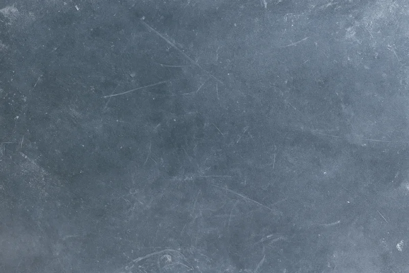 Weathered concrete surface with scratches and dust, flat lay view