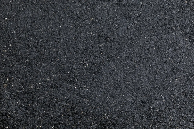 Close-up of dark asphalt surface texture filling the frame