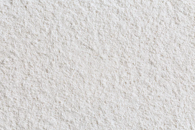 Close-up of fine white sand surface filling the frame
