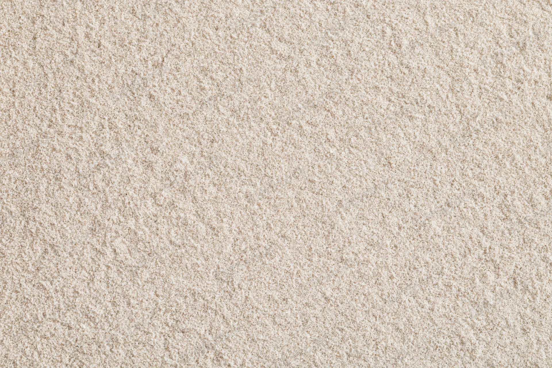 Close-up of smooth dry beach sand filling the frame