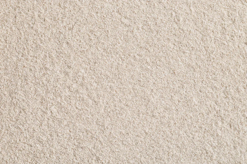 Close-up of smooth dry beach sand filling the frame