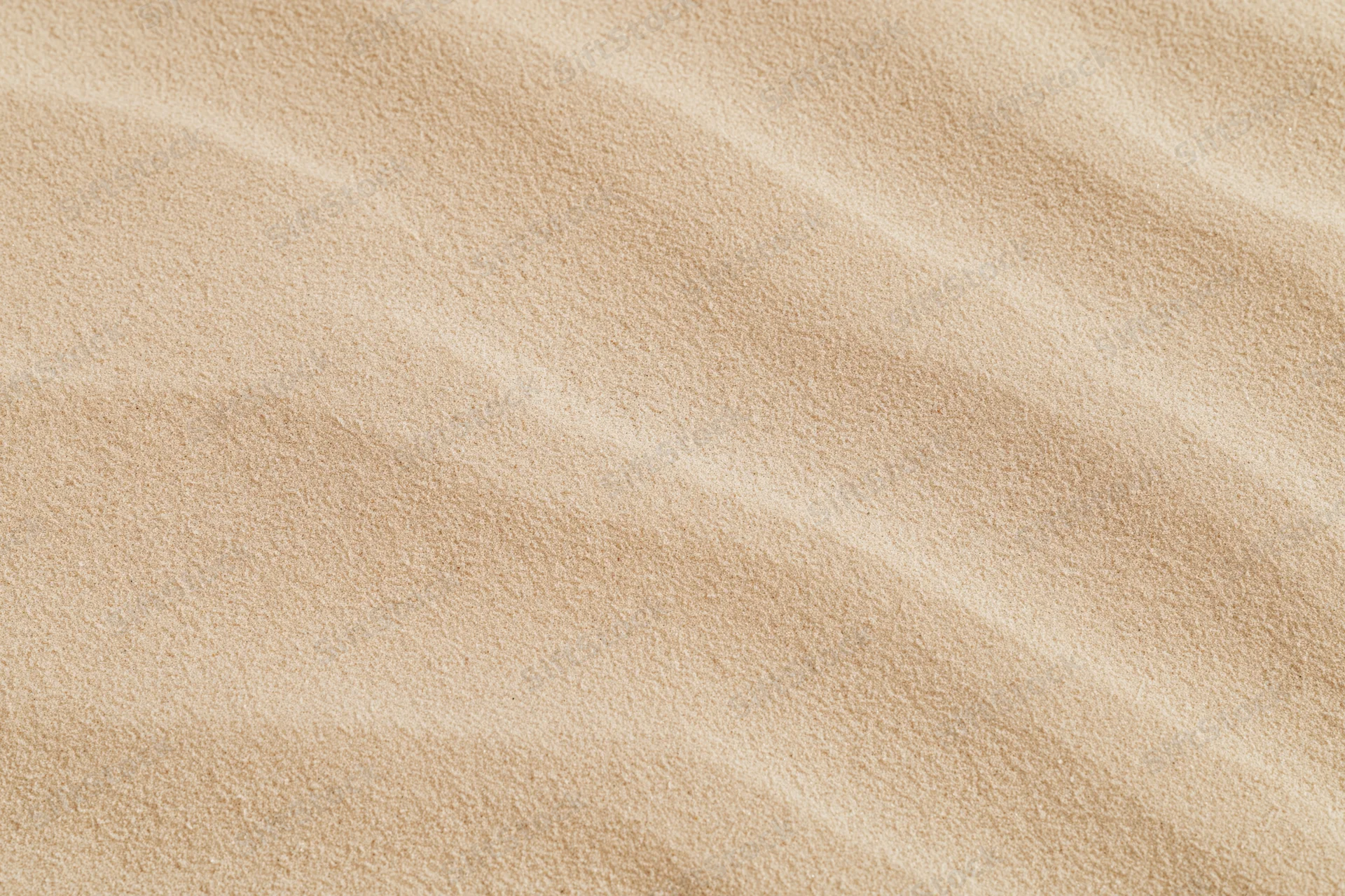 Close-up of smooth dry desert sand surface with rippled texture filling the frame
