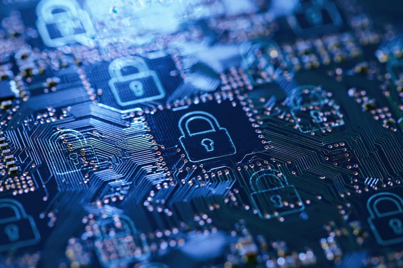 Close-up of a blue circuit board with glowing lock symbols indicating digital security