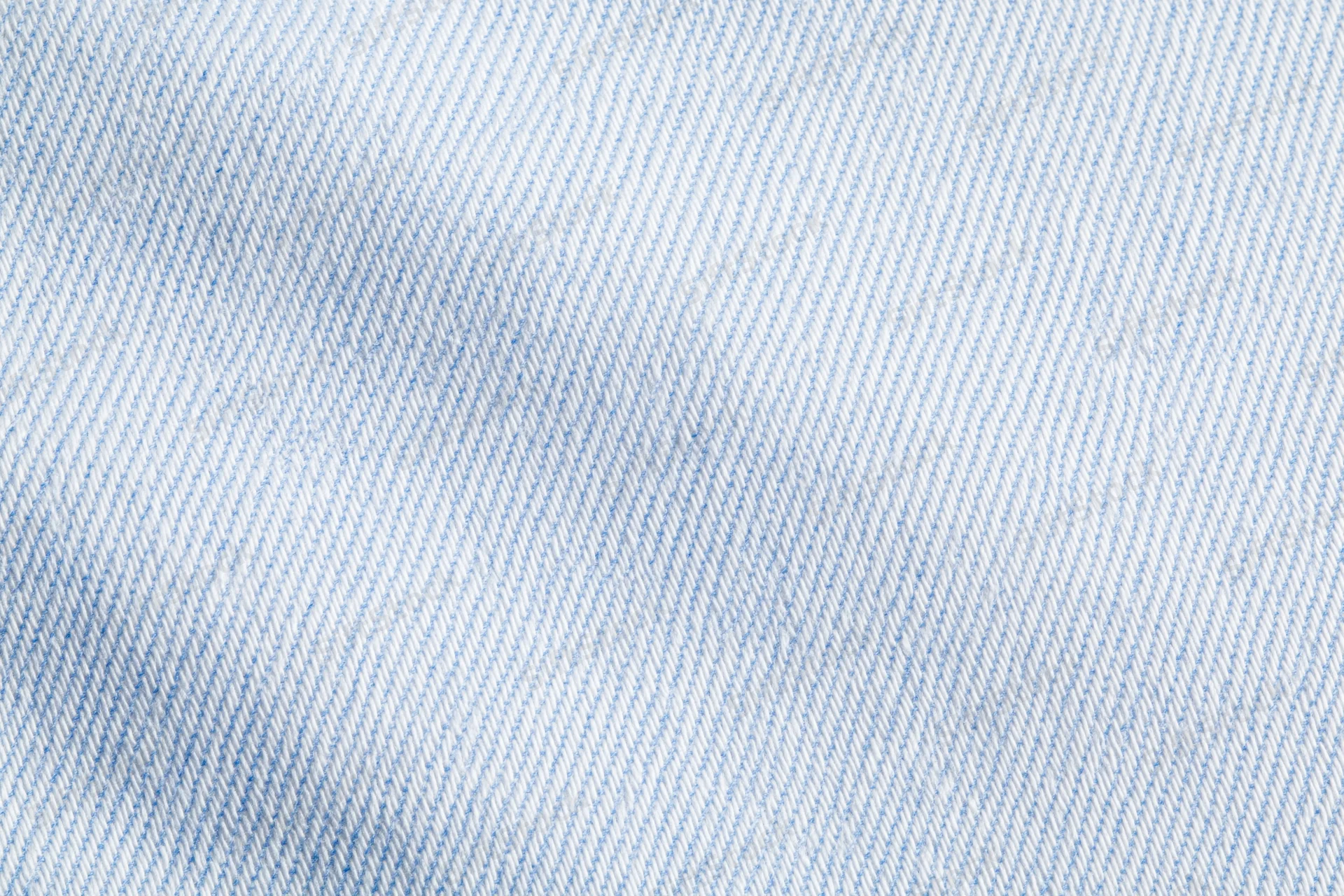 Close-up of light blue and white woven dress shirt fabric