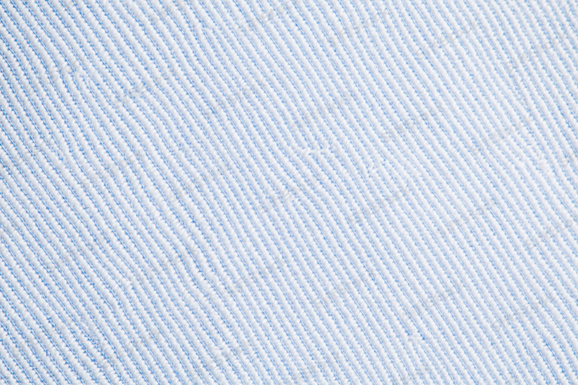 Close-up of light blue and white woven dress shirt fabric