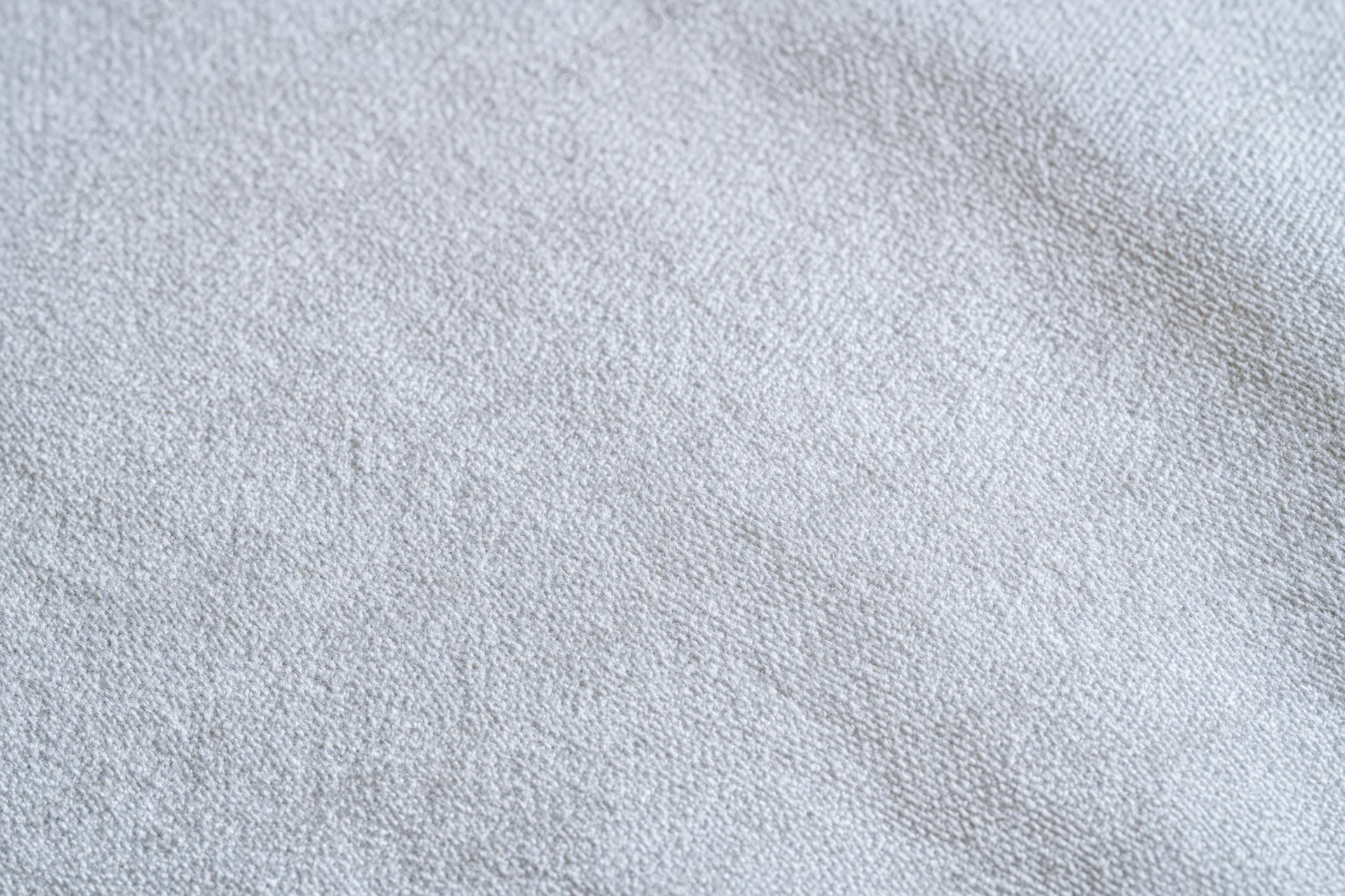 Close-up of plain white woven fabric texture filling the frame
