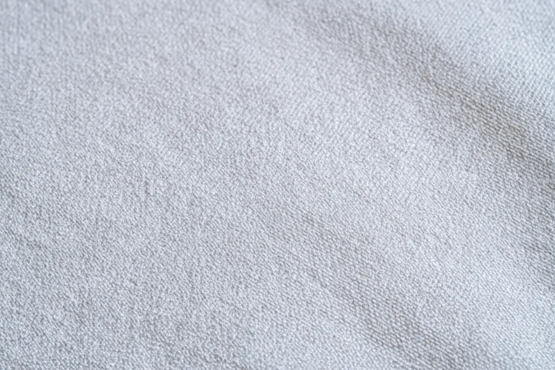 Close-up of plain white woven fabric texture filling the frame