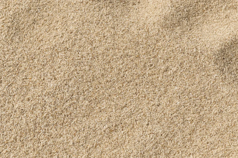 Close-up overhead view of dry beach sand filling the frame