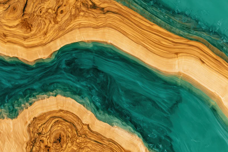 Close-up of a live-edge wood table with an epoxy resin river flowing through its natural grain