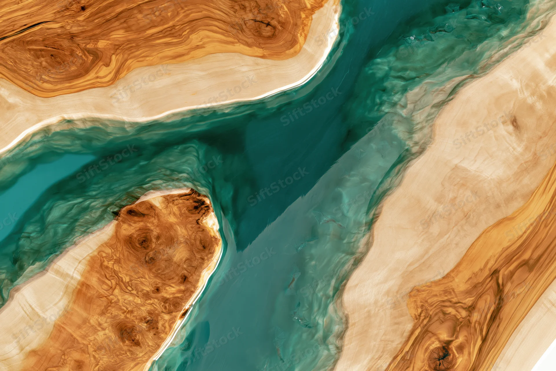 Close-up overhead view of a live-edge epoxy resin river table with natural wood grain and flowing teal resin pattern