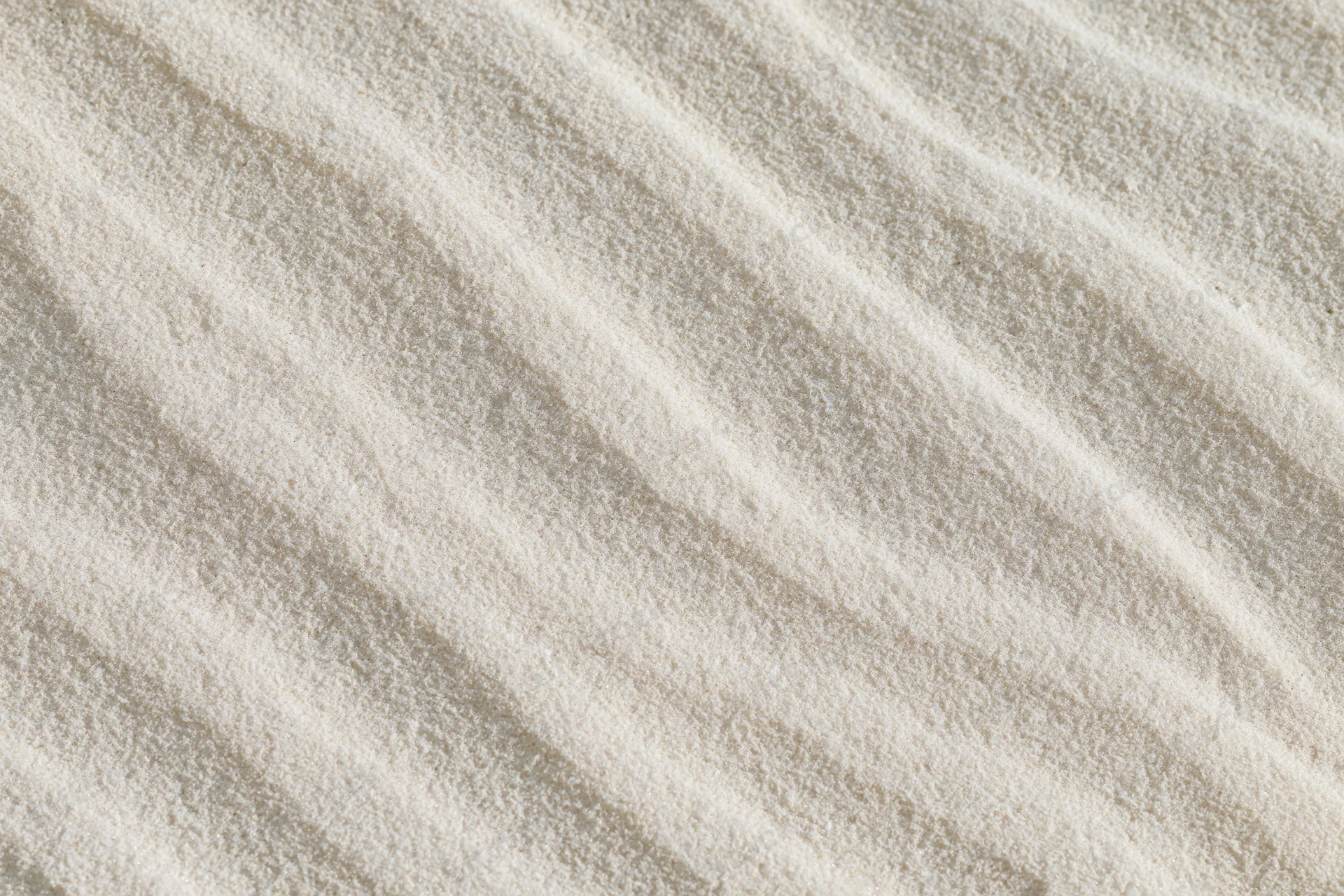 Wind-rippled sand surface in a desert landscape viewed from above