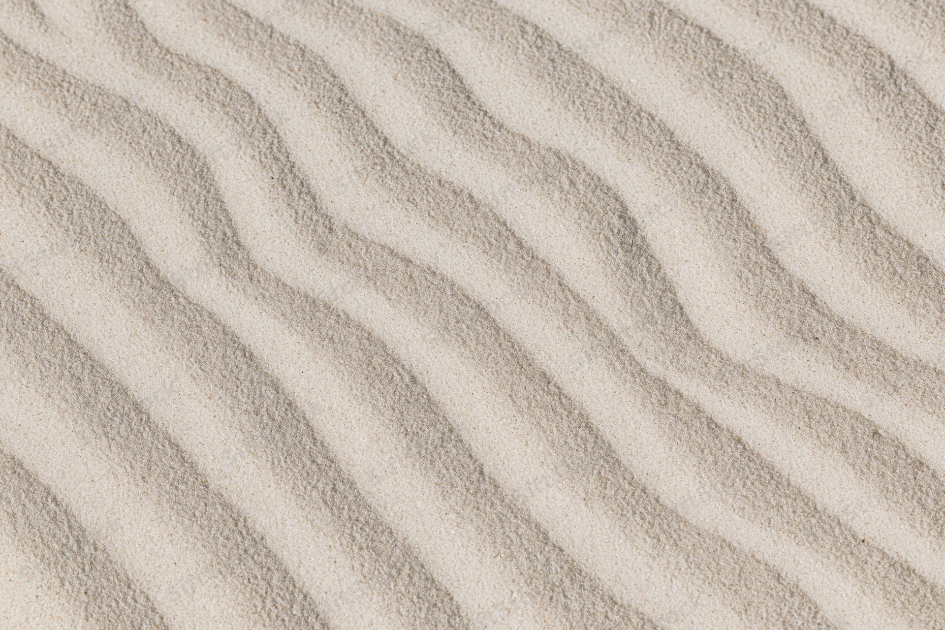 Wind-rippled sand surface in a desert landscape viewed from above