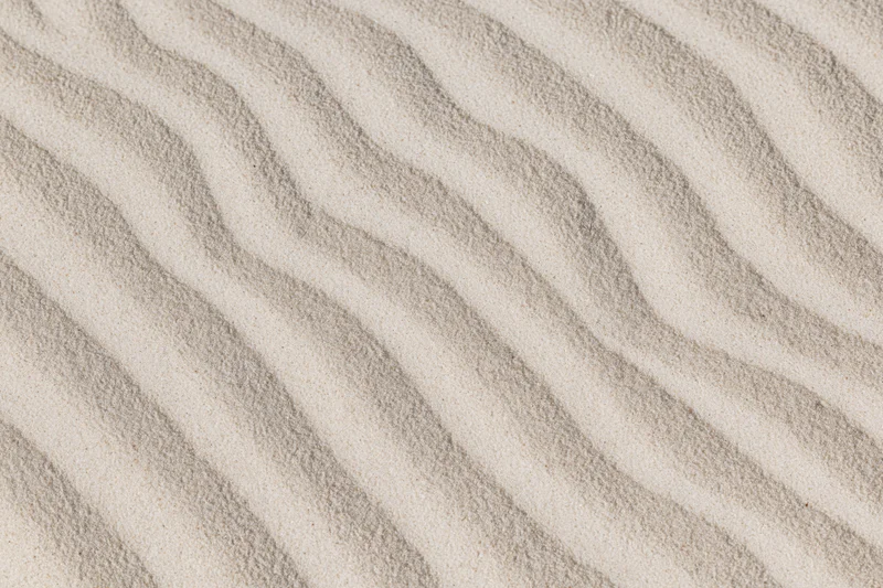 Wind-rippled sand surface in a desert landscape viewed from above