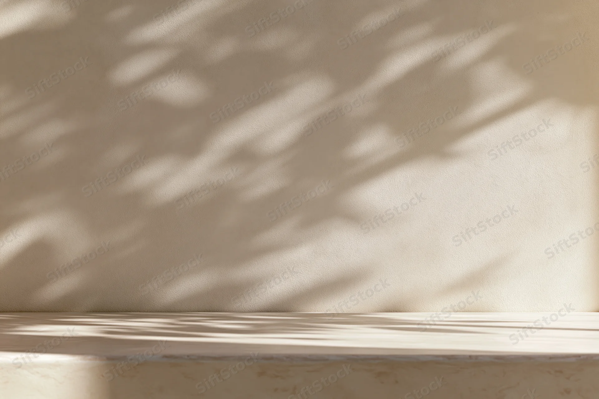 Smooth cream plaster wall with dappled sunlight shadows above a light wooden tabletop surface