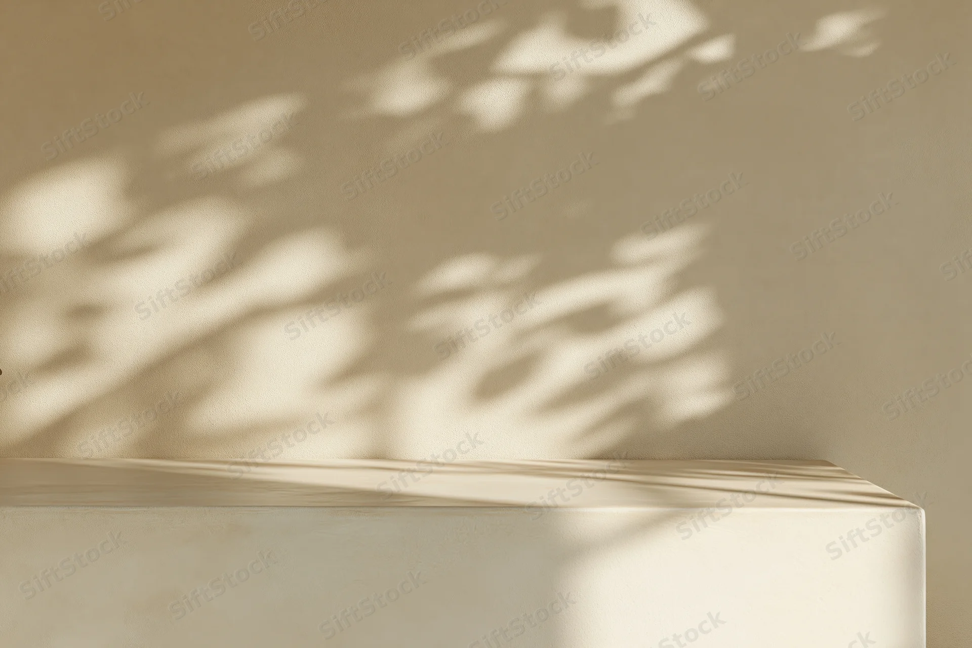 Dappled shadows from foliage cast on a cream-beige plaster wall above a smooth tabletop surface