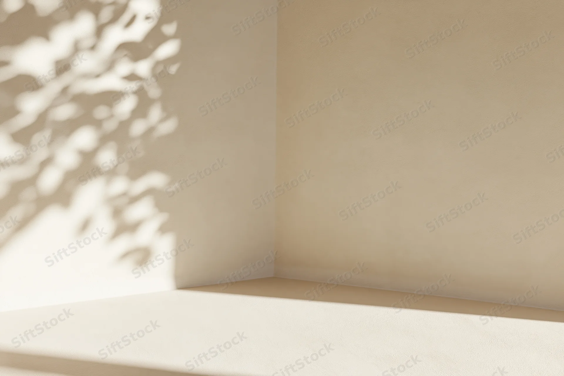 Empty corner of a cream-beige room with leaf shadows on wall and floor