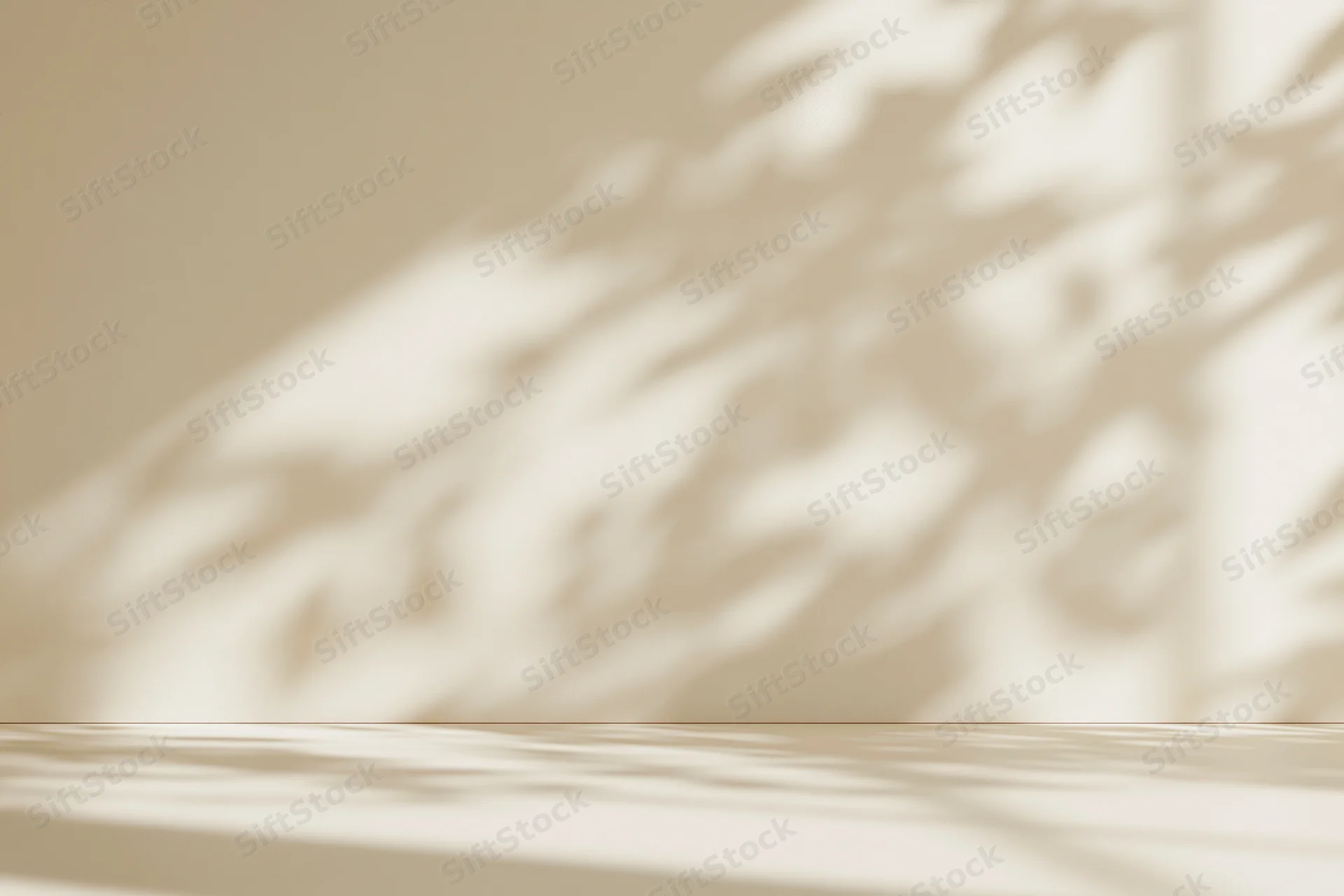 Cream-colored studio surface and wall with soft foliage shadows, empty space for product display