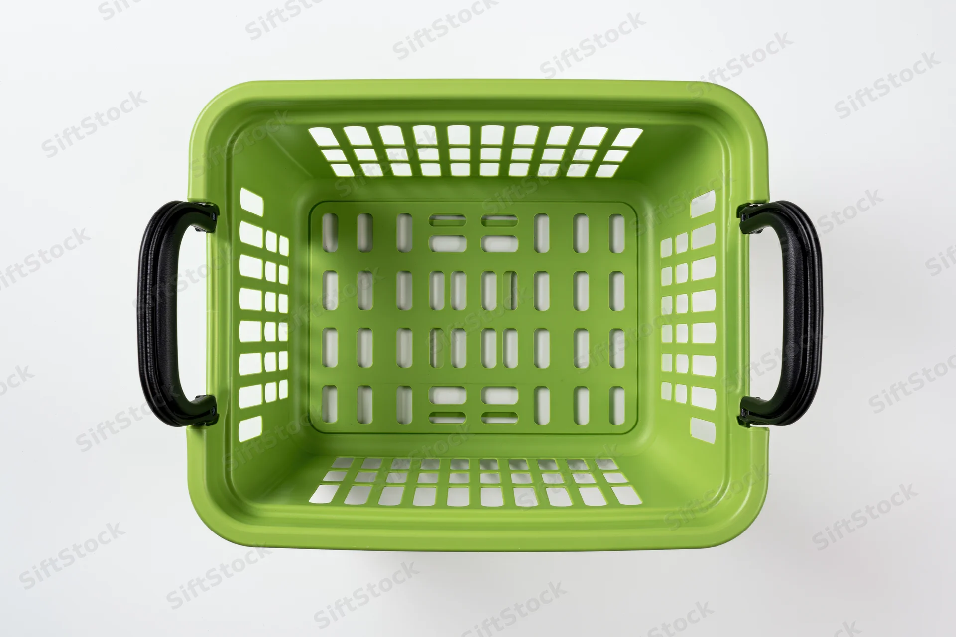 Empty green plastic shopping basket viewed from directly above on white background
