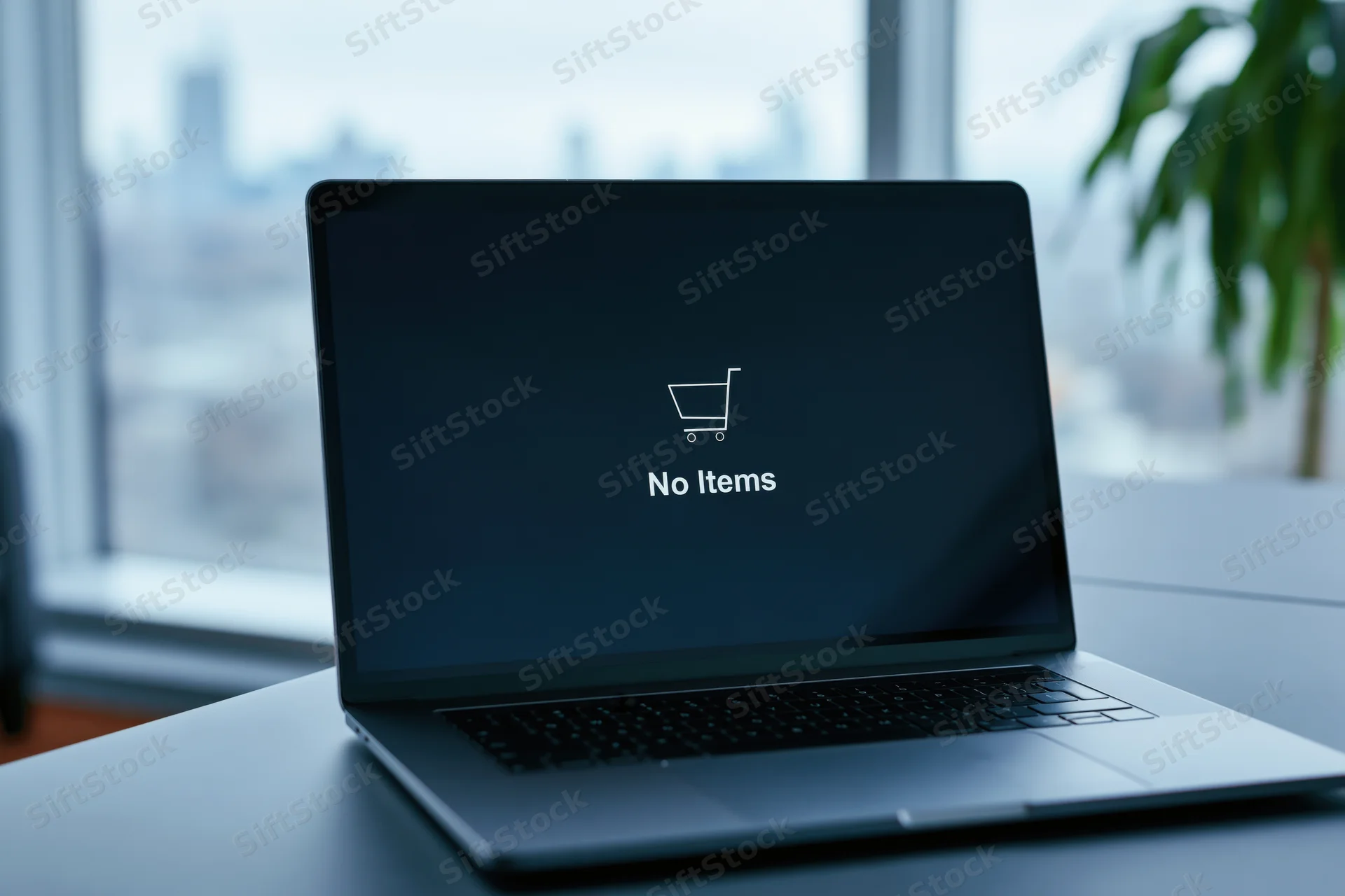 Laptop displaying empty shopping cart message on desk near window