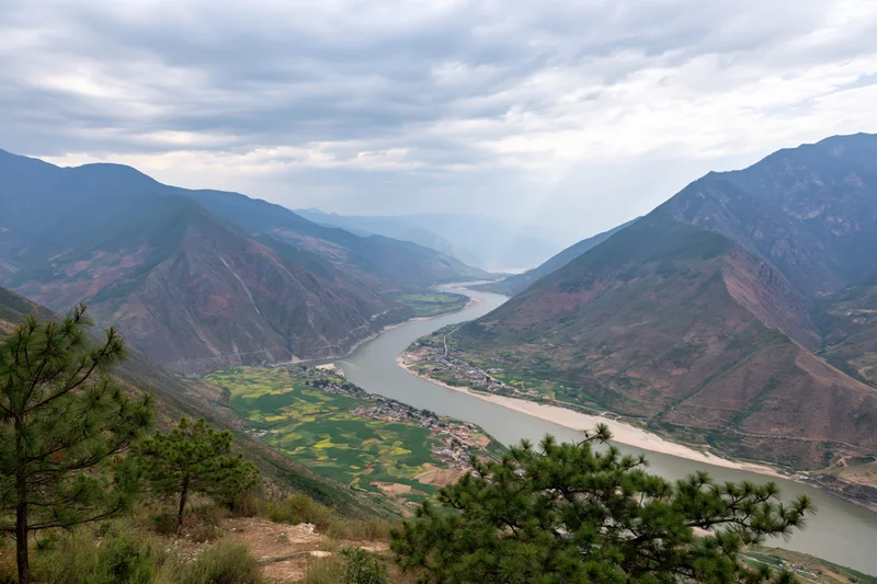 Aerial view of the yangtze river bending through a mountain valley in yunnan china