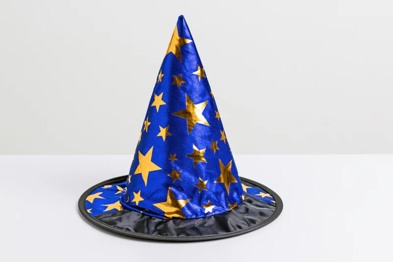Blue pointed wizard hat with gold stars on white background