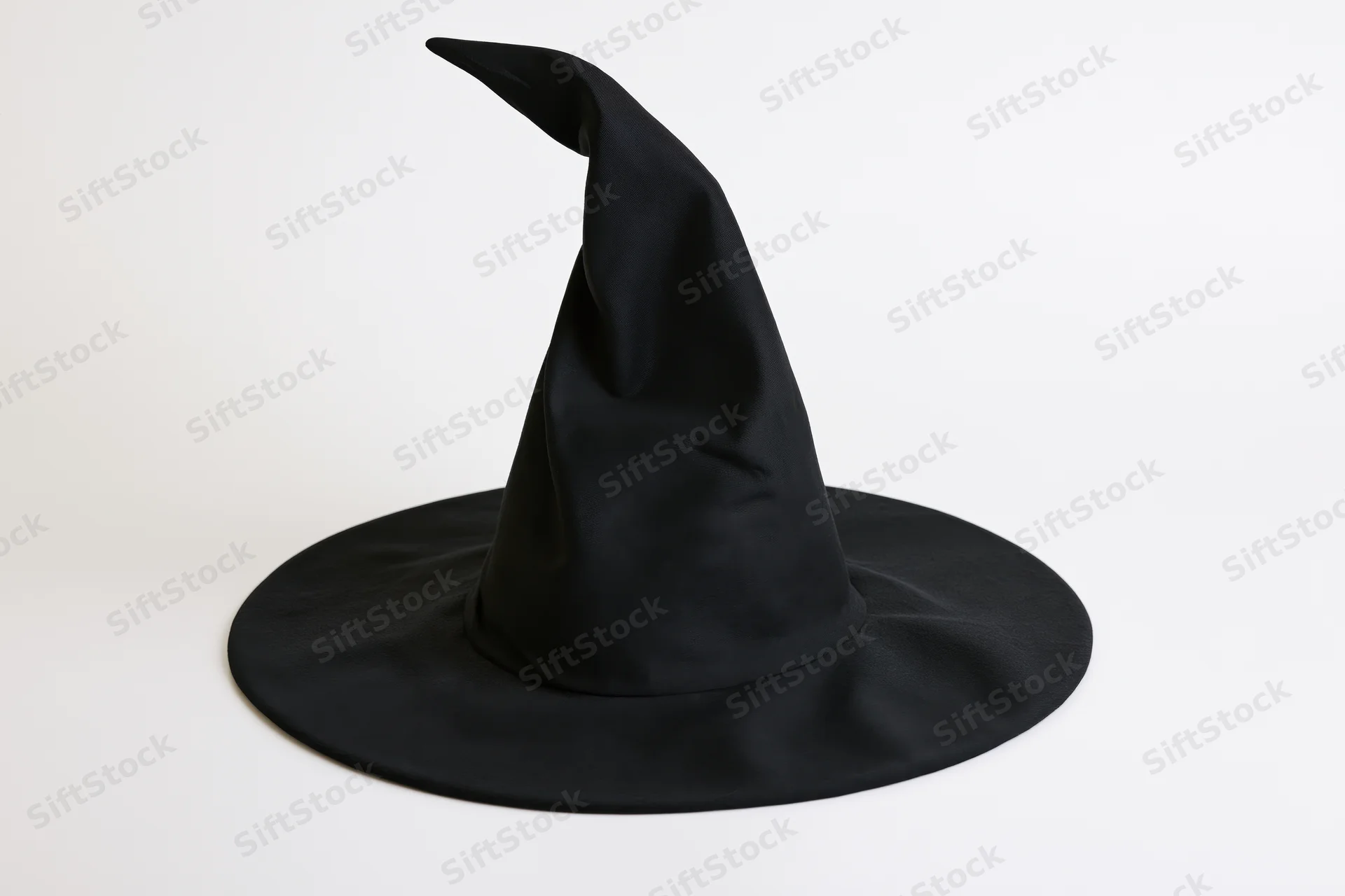 Black witch hat with tall curved pointed crown on white background
