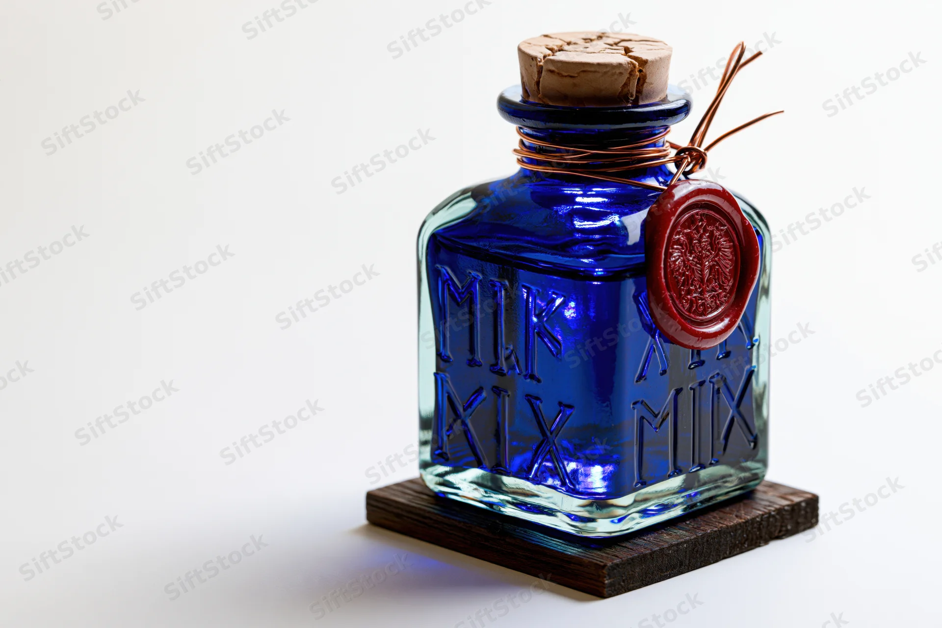 Cobalt blue glass apothecary bottle with embossed runes and red wax seal on wooden coaster