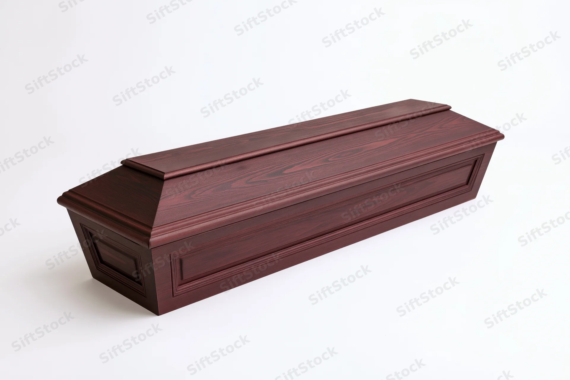 Dark mahogany wooden coffin with carved panel detailing on white background