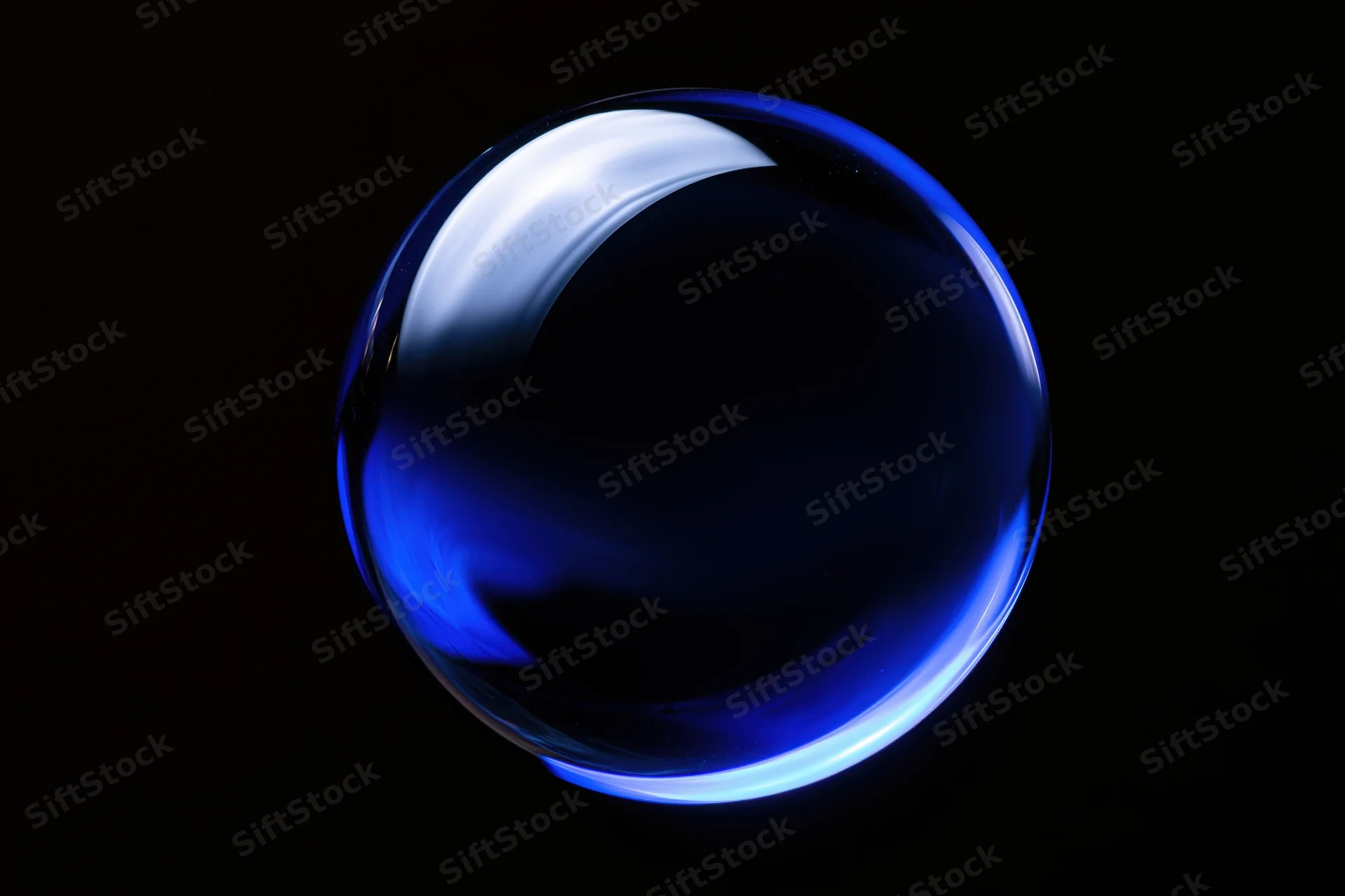 Deep blue glass sphere floating centered against pure black background