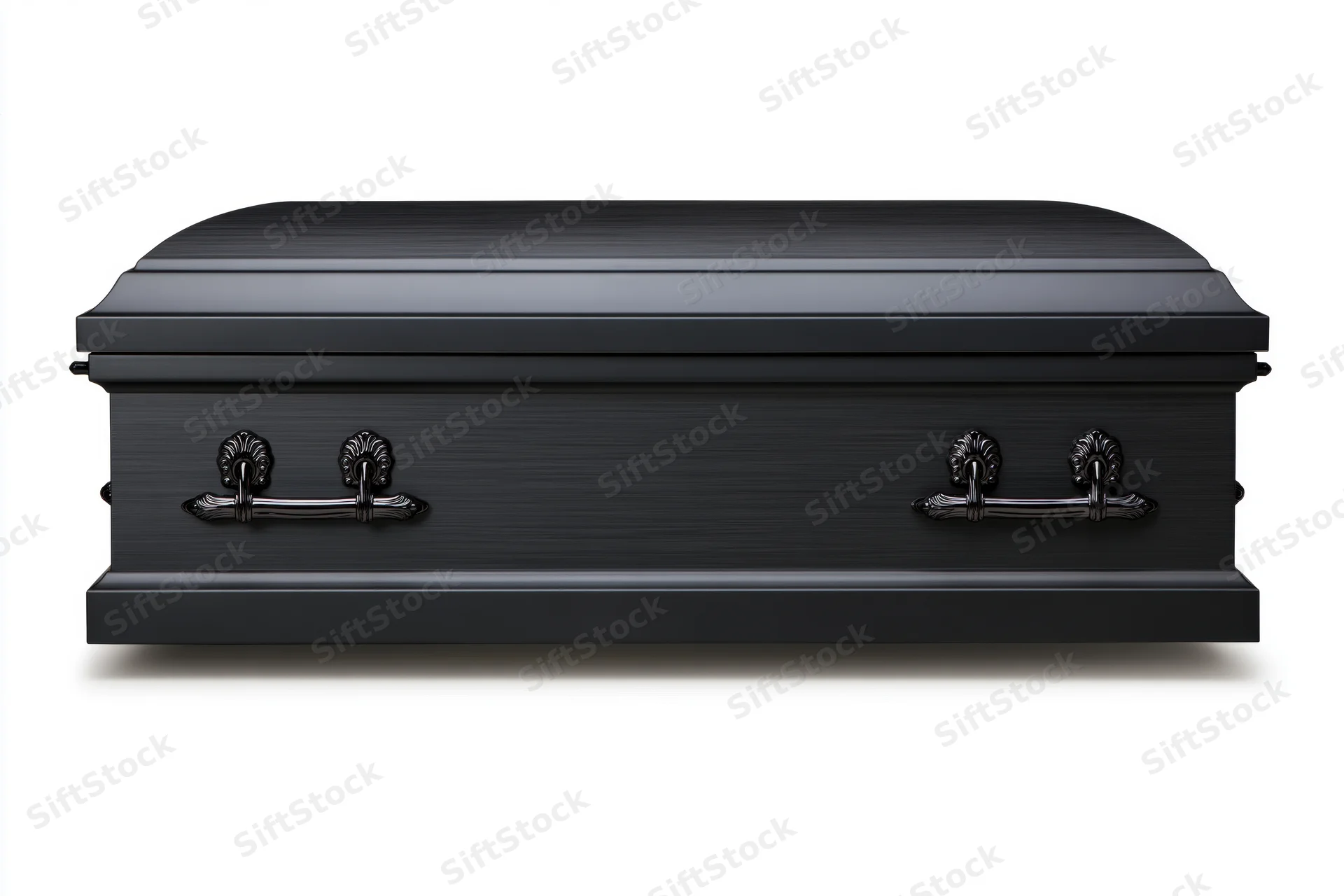 Matte black metal casket with ornate handles on white background